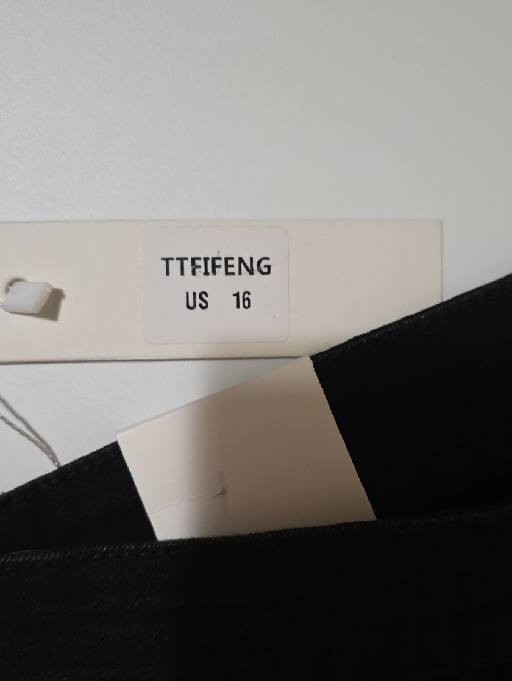 High-Rise Black Flare Jeans with Side Button Detail - Picture 9 of 9